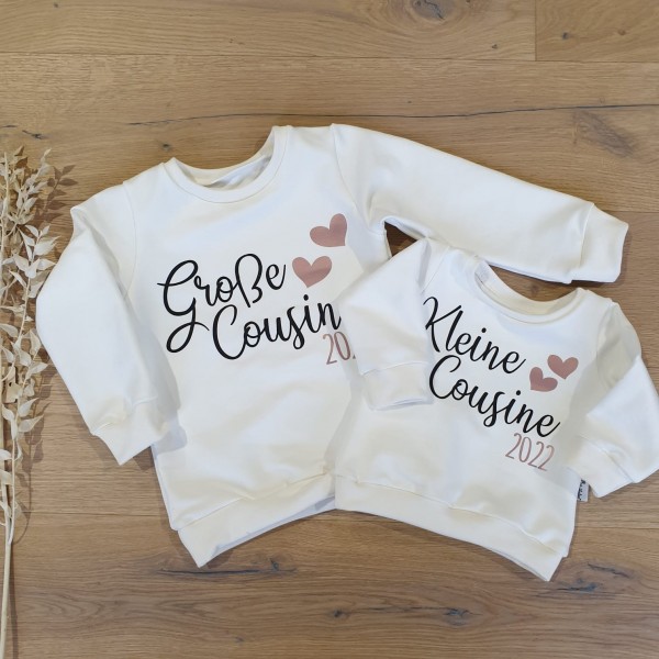 Cremeweiss - Kleine / Große Cousine 2022 (Schwarz-Rosegold) - Sweater